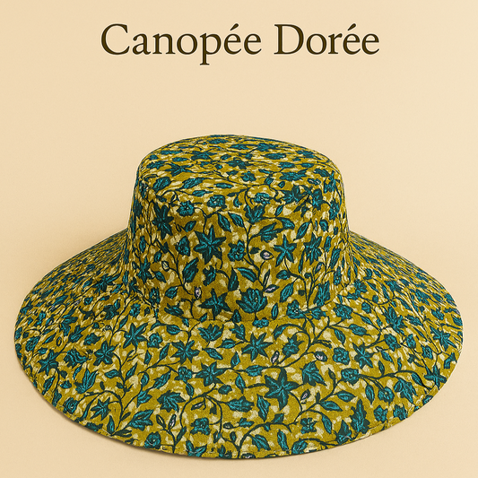 (Évoque à la fois l’ombre protectrice du chapeau et l’intensité des couleurs et des cultures qu’il incarne. Élégant, évocateur, et fort visuellement.)